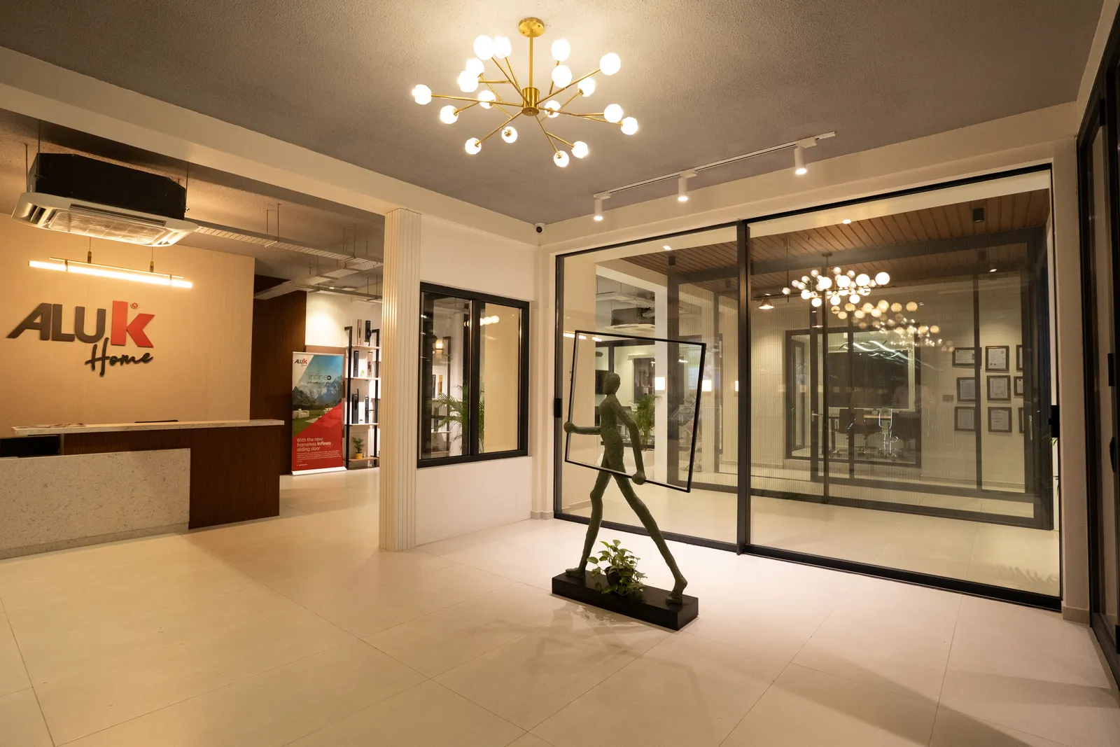 Aluk Home showroom with reception and window systems on display — Aluk Experience Center